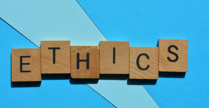 Ethics, word in wooden alphabet letters isolated on background as banner headline